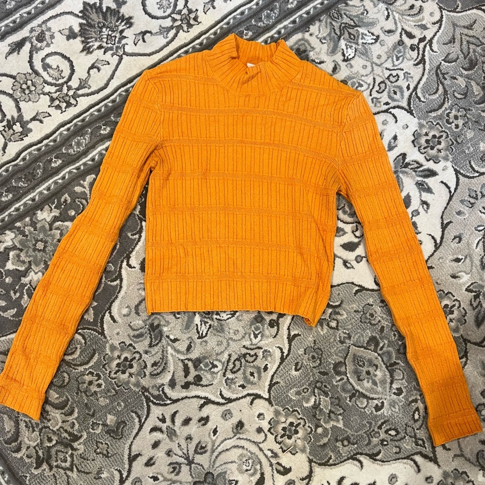 Orange turtleneck